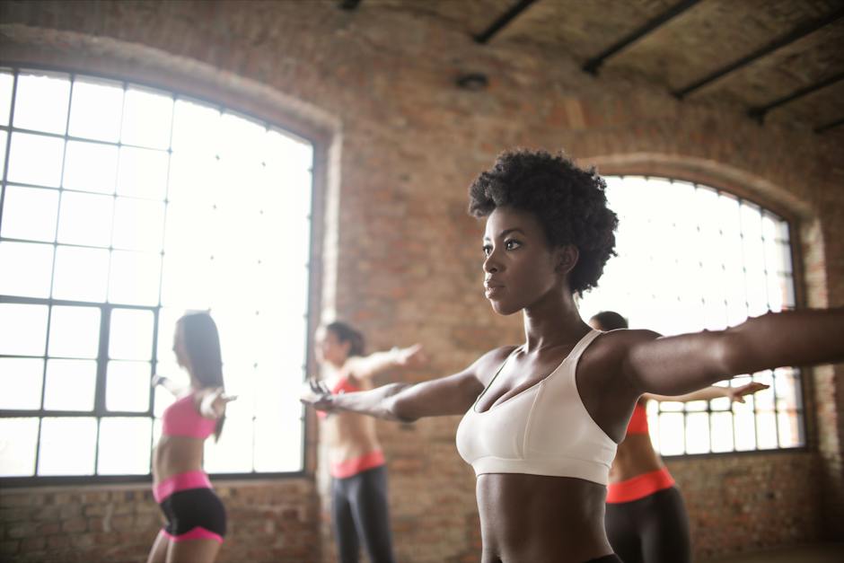 Women in Workout Wear Activewear Tops working out.